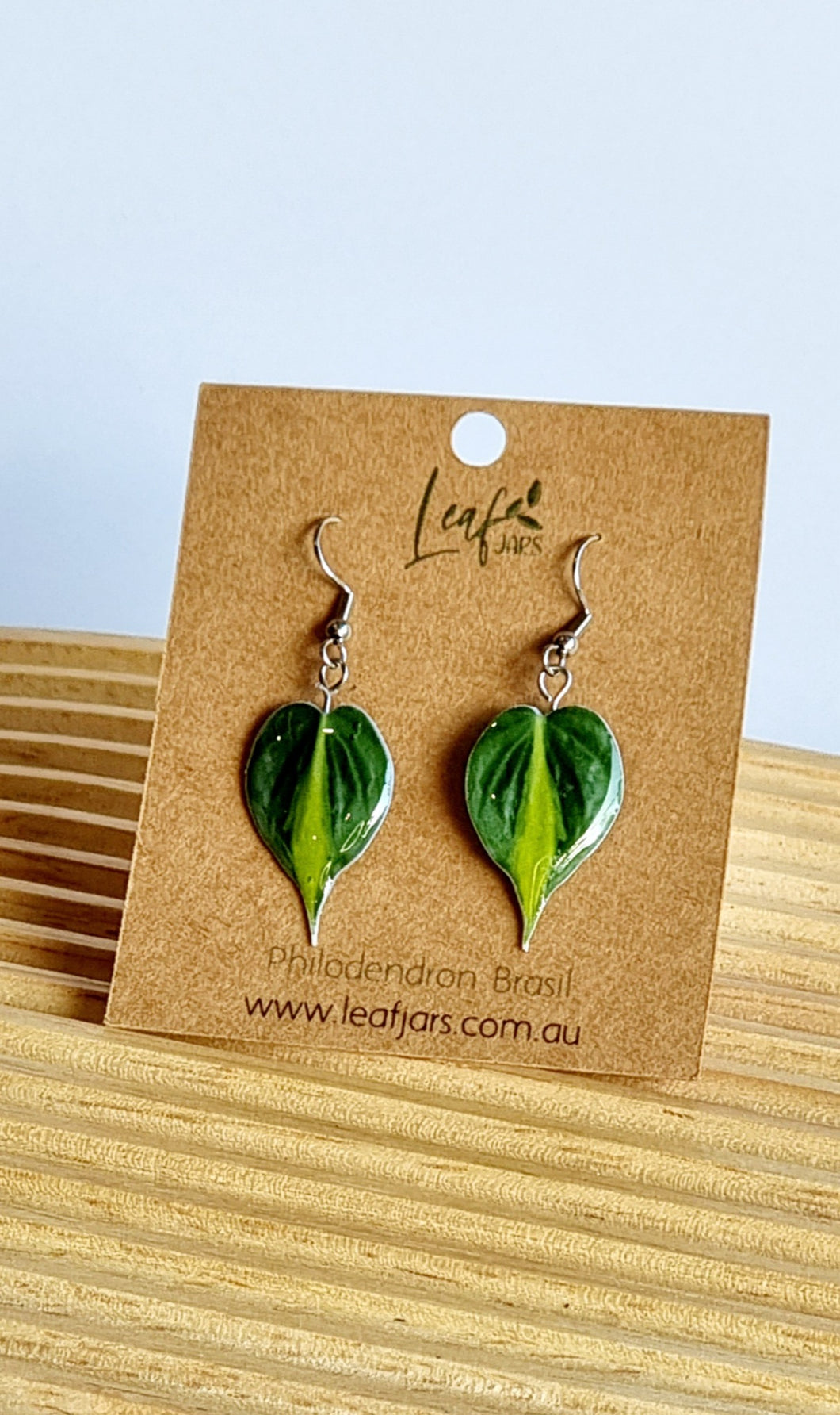 Philodendron Brasil Leaf Earrings on timber board