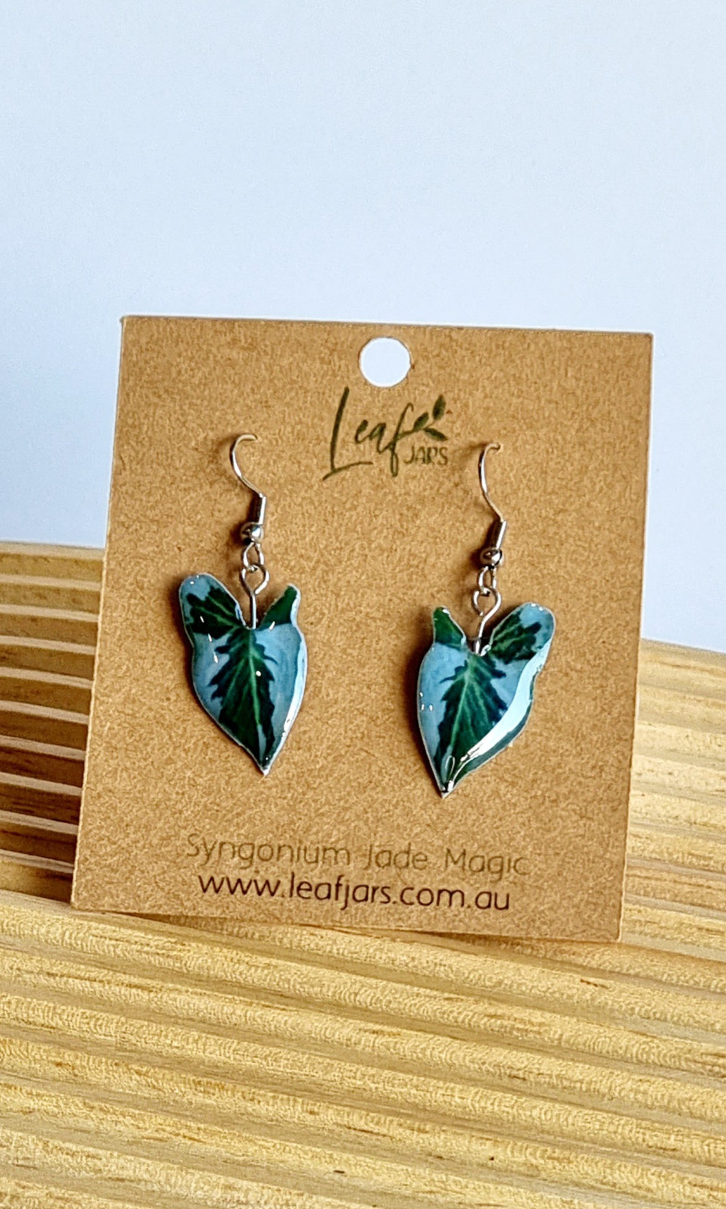 Syngonium Jade Magic Leaf Earrings on timber board