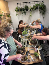 Load image into Gallery viewer, Terrarium workshop participants busy creating their enchanted gardens
